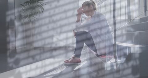 Stressed Doctor Sitting on Stairs with Rain Reflection - Download Free Stock Images Pikwizard.com