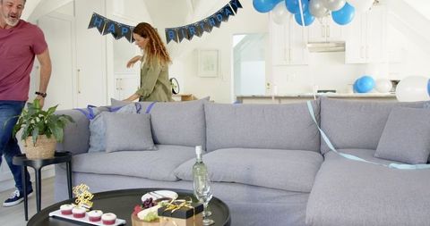 Couple Organizing a Surprise Birthday Celebration at Home