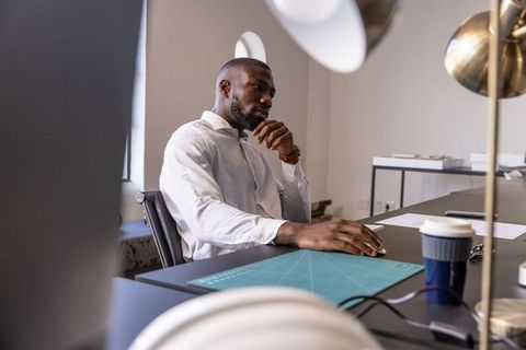 Focused professional working at modern office workspace