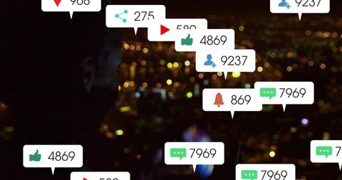 Silhouette holding smartphone on rooftop at night with floating social media notification bubbles