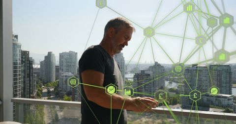 Man Using Smartphone with Digital Network Overlay of Global Connectivity Icons