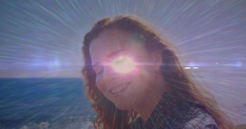 Radiant Woman Enjoying Serene Coastal Sunset