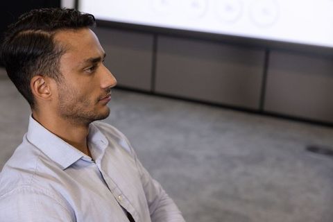 Business Professional Focusing in Corporate Meeting