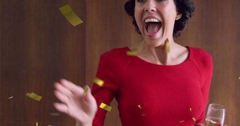 Woman in Red Celebration at Party with Champagne