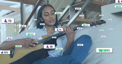 Woman Engaging in Social Media While Playing Guitar