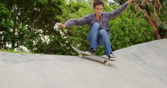 Young Man Skateboarding at Concrete Skate Park - Download Free Stock Images Pikwizard.com