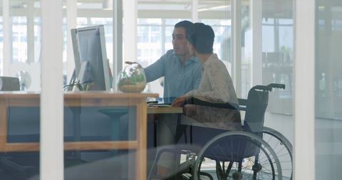 Teamwork in Office with Personnel in Wheelchair