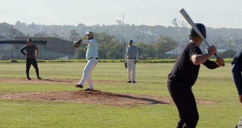 Pitcher Delivering Fastball to Batter on Community Baseball Mound | Amateur Team Action