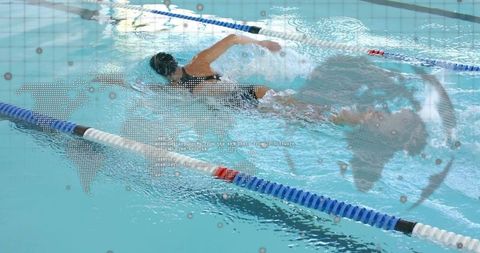 Female swimmer slicing through lap pool water with digital world map overlay and data dots