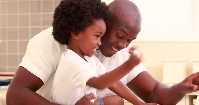 Loving African American Father Hugging Cheerful Son in Kitchen - Download Free Stock Images Pikwizard.com