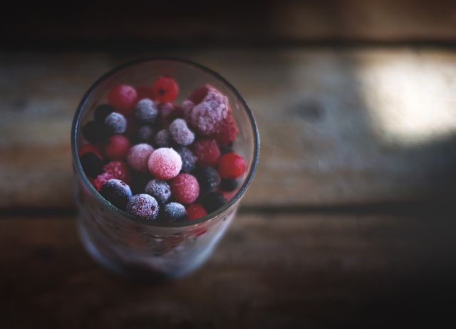 Frozen Berries in Glass on Rustic Wooden Table - Download Free Stock Photos Pikwizard.com