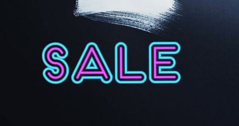 Vibrant neon sale text on black background with brush stroke