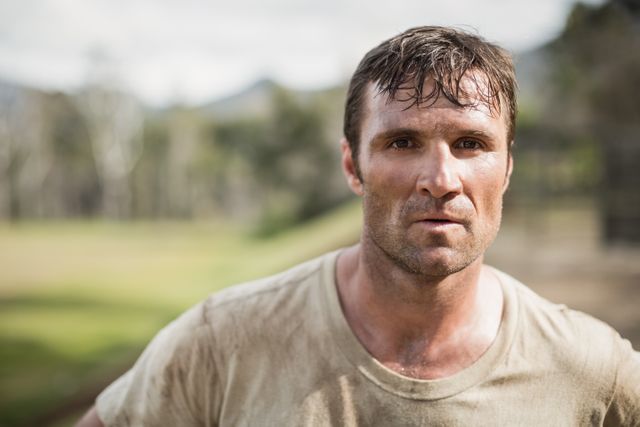 Portrait of military man standing during obstacle course in boot camp