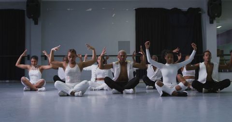 Diverse dance group rehearsing contemporary routine together