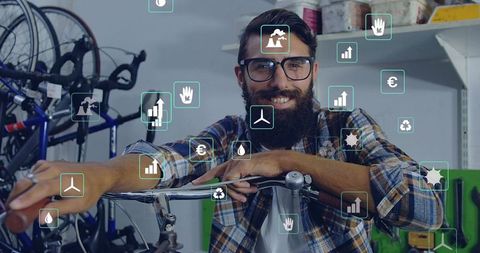 Bearded Mechanic Displaying Bicycle Data Visuals in Workshop