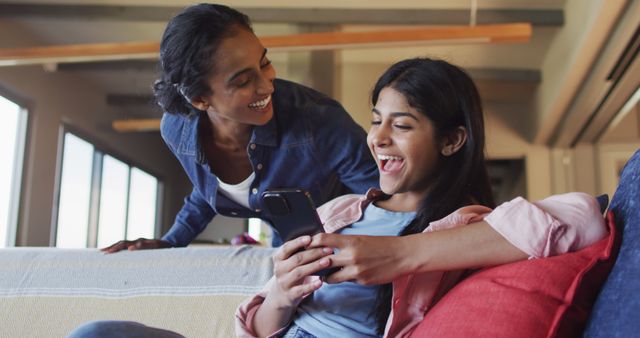 Mother and Teenage Daughter Sharing a Happy Moment on Smartphone - Download Free Stock Images Pikwizard.com