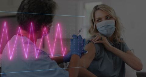 Nurse administers vaccine wearing safety gloves