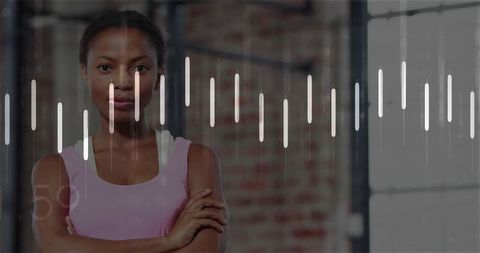 Confident woman standing with arms crossed in industrial gym loft with waveform overlay