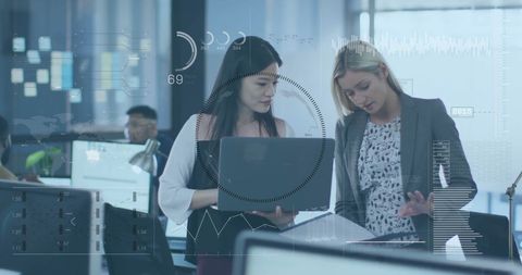 Business Team Analyzing Data in Modern Office with Futuristic Charts