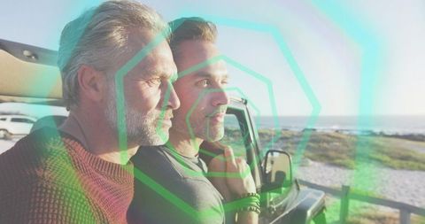 Two men gazing toward ocean from suv at golden hour with teal geometric overlay