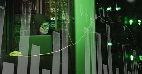 Hacker Analyzing Digital Data on Laptop in Dark Room