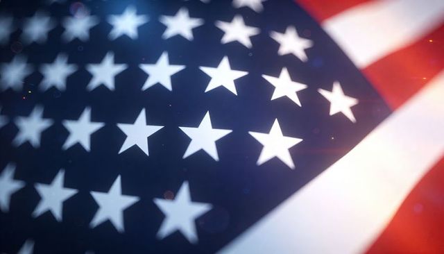 Close-up american flag stars and stripes with cinematic bokeh, lens flare, fabric texture