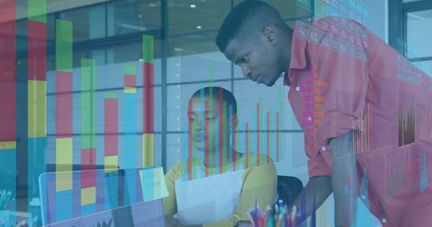 Coworkers Collaborating on Data Analytics in Modern Office