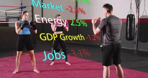 Boxing coach training two athletes on red mat with financial data overlay concept