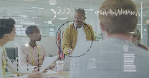 Design team collaborating on garment development with lead presenting and hud overlay