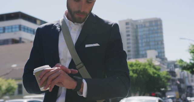 Businessman Checking Smartwatch on Busy City Street - Download Free Stock Images Pikwizard.com