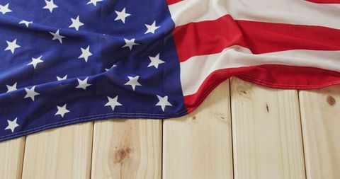 American Flag Draped on Wooden Surface Representing Patriotism