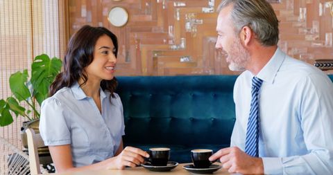 Business Professionals Enjoying Coffee Break in Charming Cafe