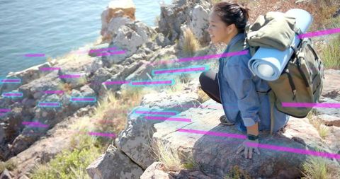 Happy asian woman enjoying nature by cliffside inlet