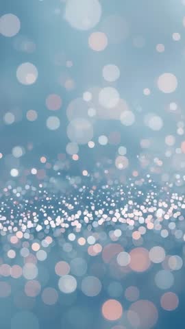 Soft Blue Bokeh Vertical Video Loop with Sparkling Light Particles and Dreamy Glow