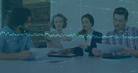 Team Collaborating on Data in Modern Office