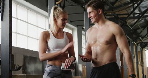 Athletic Duo Engaged in Fitness Training Conversation - Download Free Stock Images Pikwizard.com