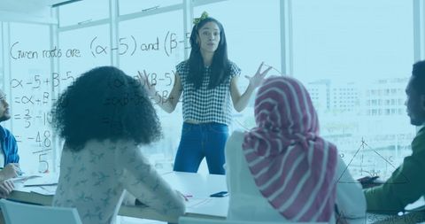 Businesswoman Explaining Mathematics in Casual Meeting