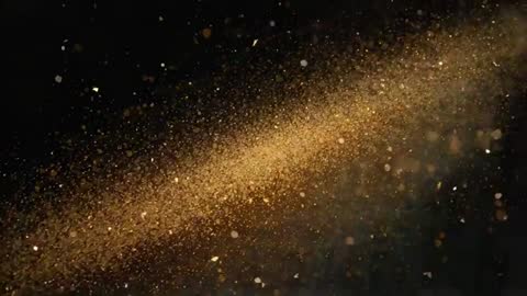 Drifting golden particle plume shimmering across black backdrop for luxury motion graphics