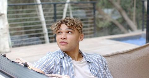 Casually Relaxing Outdoors by Modern Deck and Pool