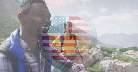 Joyful Diverse Couple Hiking with American Flag Overlay in Rocky Mountains