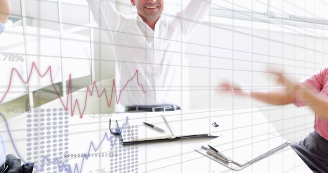 Image of graphs with numbers over excited diverse coworkers stacking hands at desk - Download Free Stock Photos Pikwizard.com