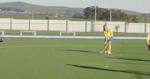 Female field hockey players in practice session