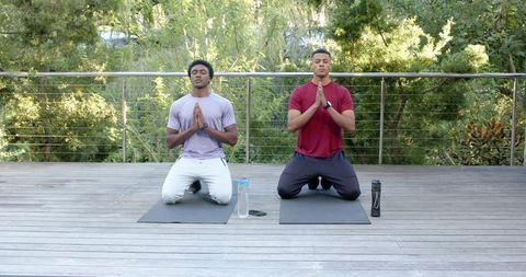 Diverse Friends Meditating Outdoors on Yoga Mats in Serenity