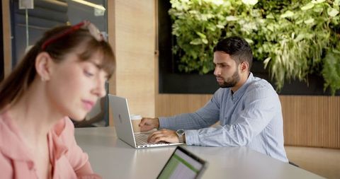 Modern Coworking Environment with Professionals Using Technology