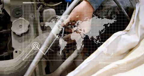 Mechanic repairing engine with digital world map overlay, automotive workshop closeup