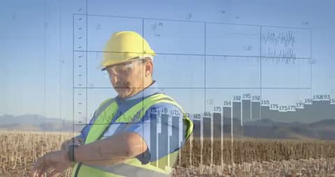 Field Technician Analyzing Wind-Energy Data with Modern Technology