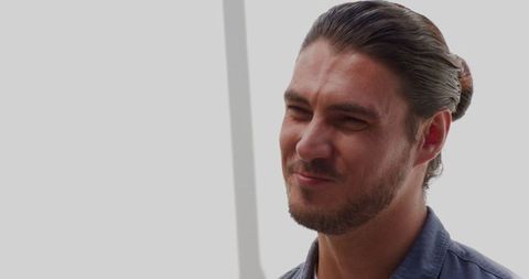 Mature Man in Blue Shirt Smiling Outdoors