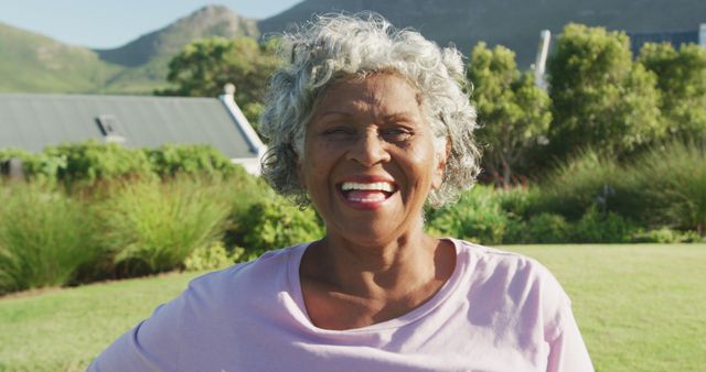 Portrait of happy senior african american woman in garden on sunny day at retirement home - Download Free Stock Photos Pikwizard.com