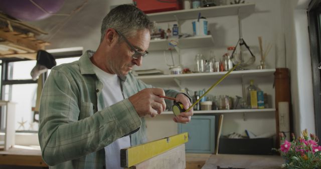 Craftsman Measuring Woodboard in Workshop - Download Free Stock Images Pikwizard.com