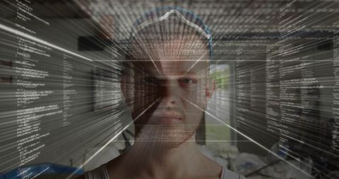 Futuristic coder staring through holographic code overlay with cyber interface in bedroom
